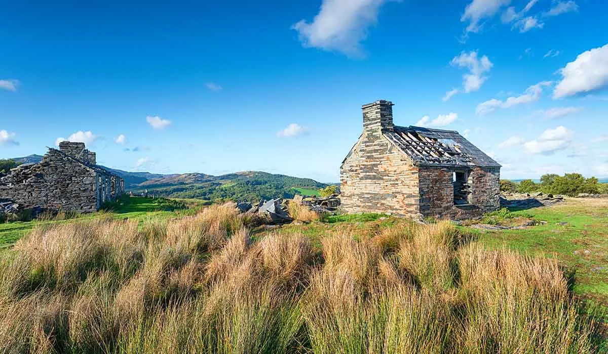 Photo of some abandoned quarry buildings suitable for renovation.