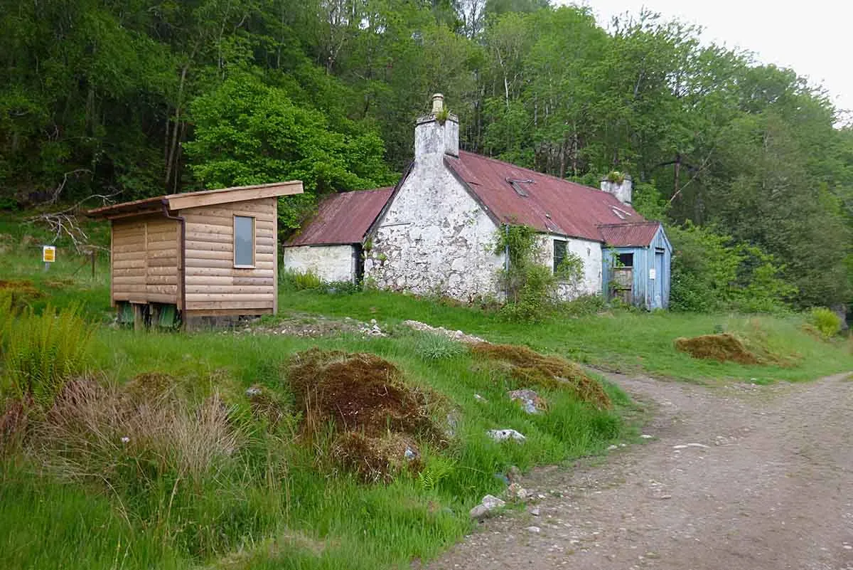 Photo showing a cottage for sale in scotland which needs to be renovated.