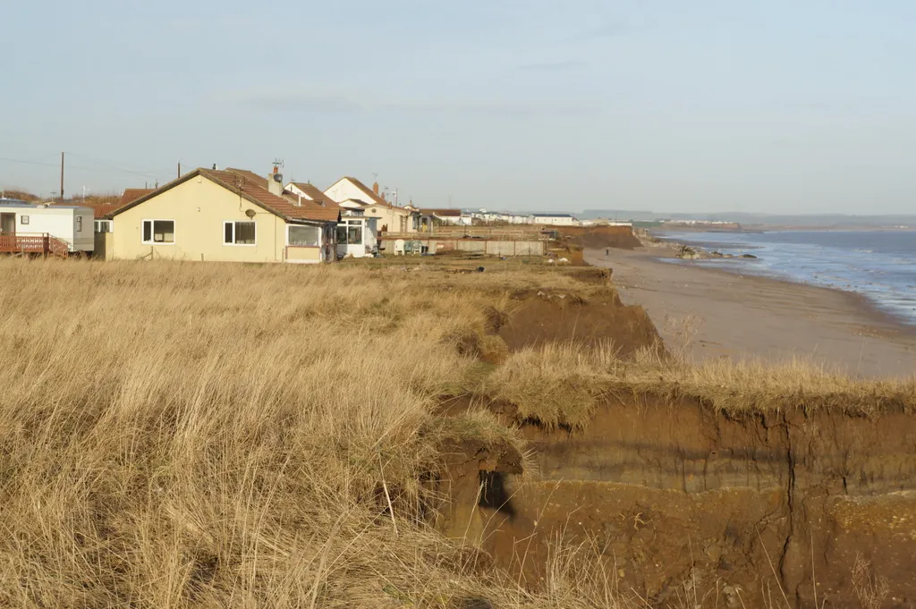 Photo showing coastal erosion which can affect the price of coastal property for sale in Wales.