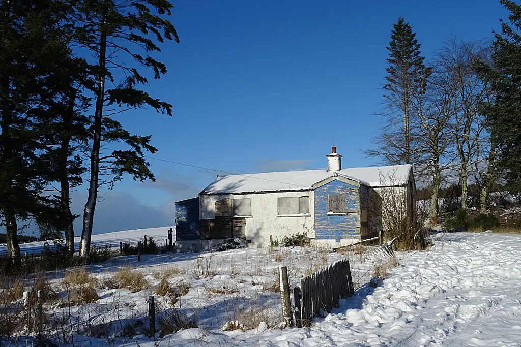 Photo of a country cottage in the snow