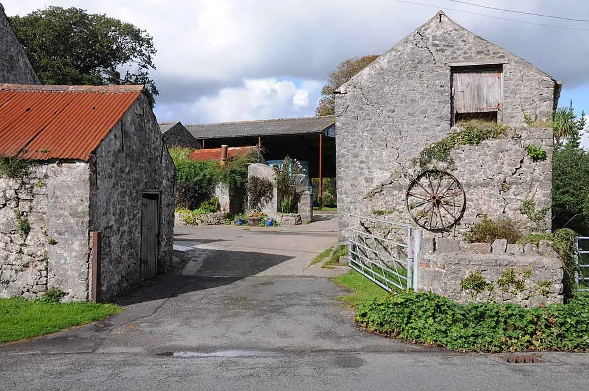 Photo showing a farm for sale in Wales with outbuildings.