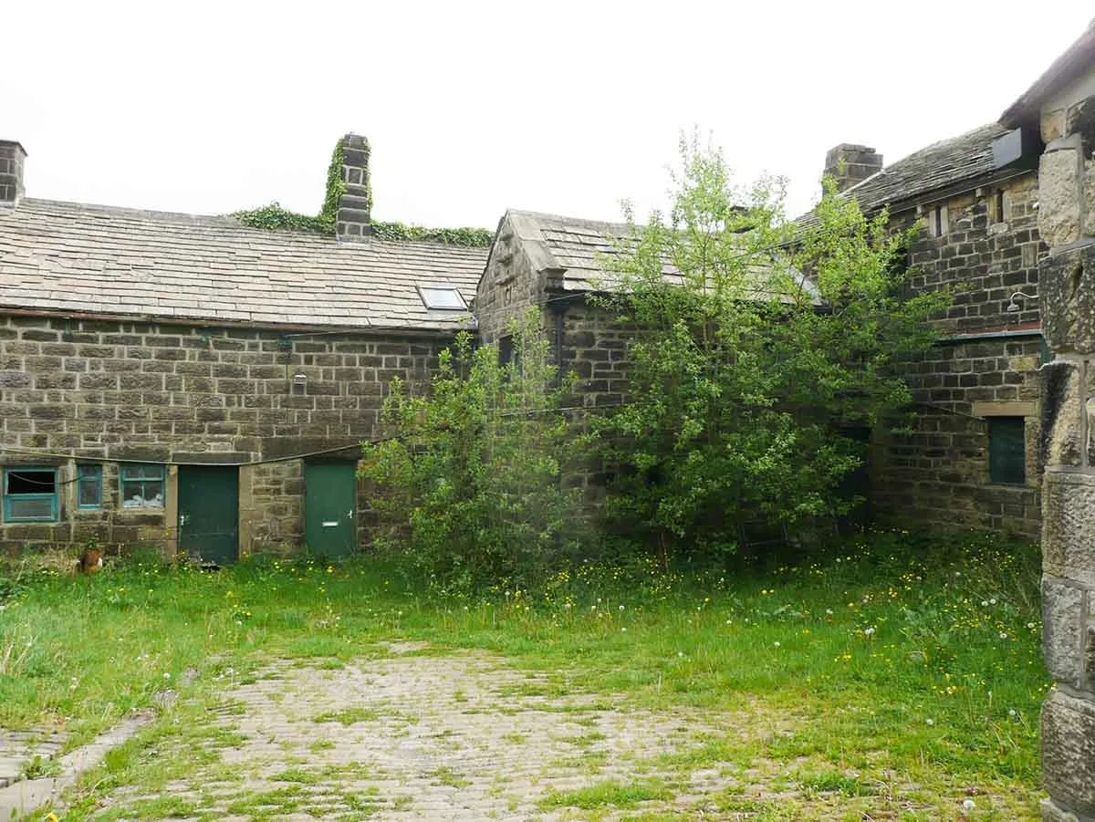 Photo of some stone outbuildings ona small farm.