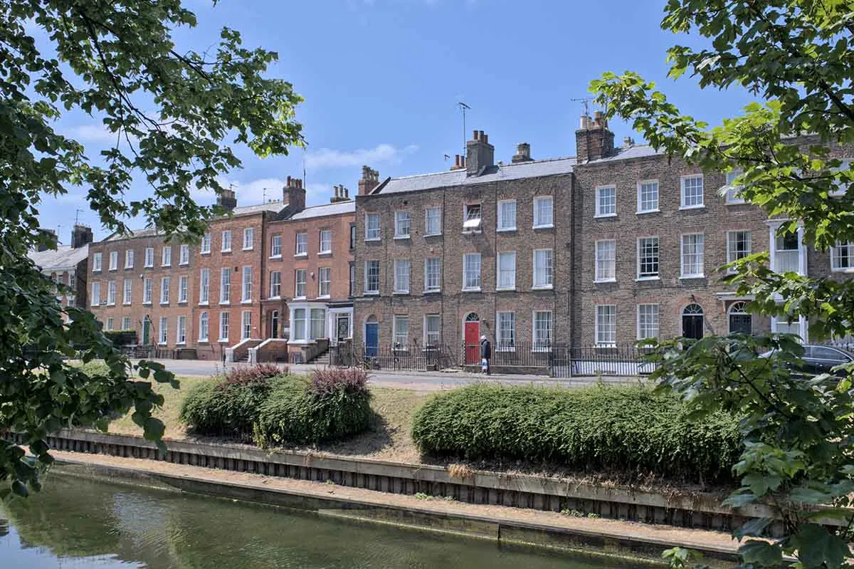 Photo of a waterfront consisting of Georgian houses.