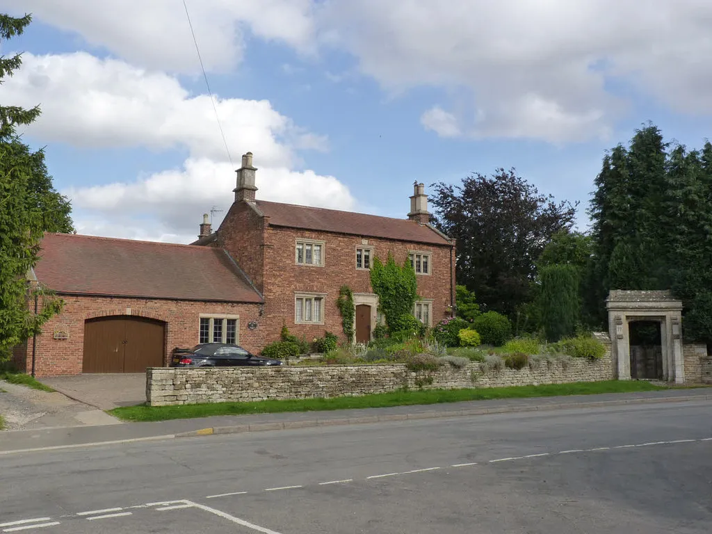 Photo of a grade II listed property with an extension.