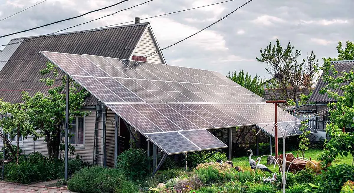 Photo showing a house with a solar panel setup.