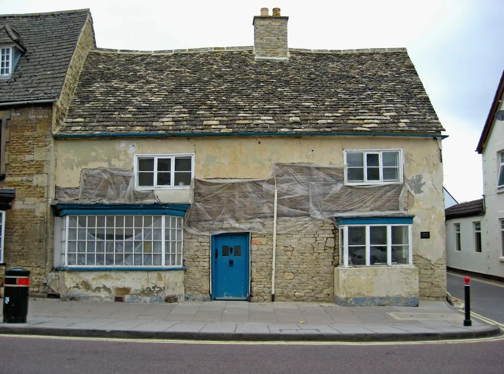 Photo of an older house being renovated