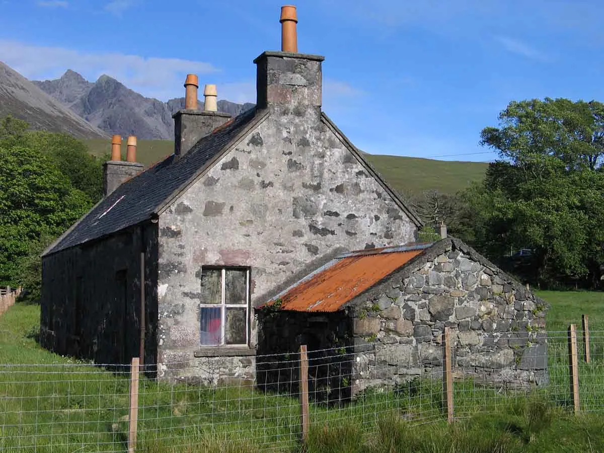 Photo of a smallholding in Scotland with a derelict cottage.