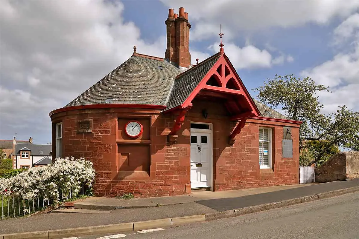 Photo of a beautiful sandstone former toll house.