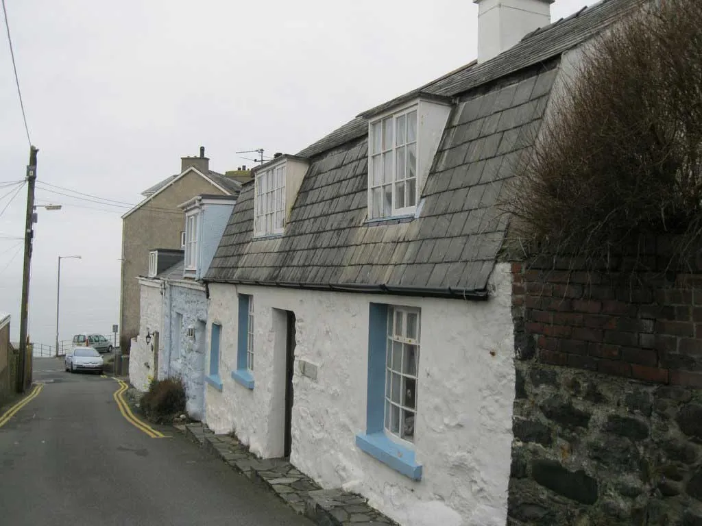 Photo of an older seaside cottage in Wales.