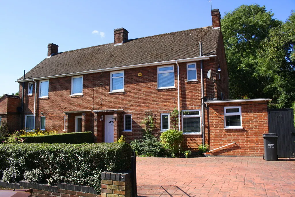 Photo of a house with a small extension on one end