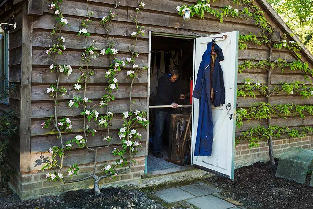 Photo of a traditional wooden garden shed in the UK