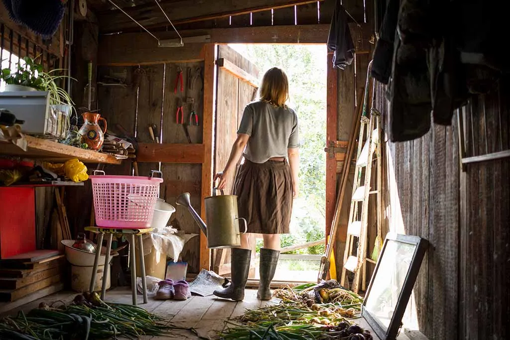 Photo of a woman in her garden shed