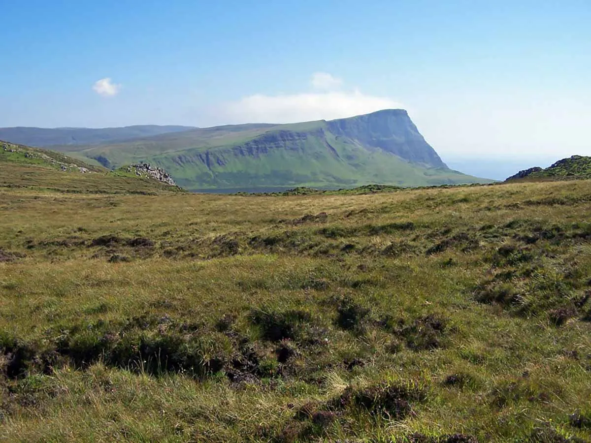 Photo of a stunning landscape in Scotland with high cliffs and endless moorland.