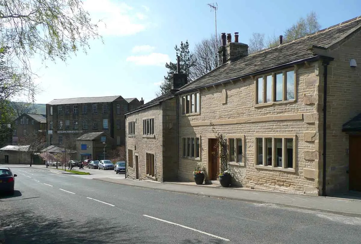 Photo of some yellow sandstone homes in northern England.