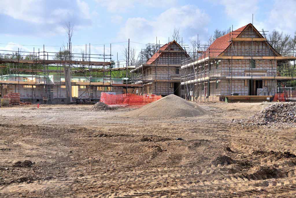 Photo showing building plots in Essex and new houses being built.