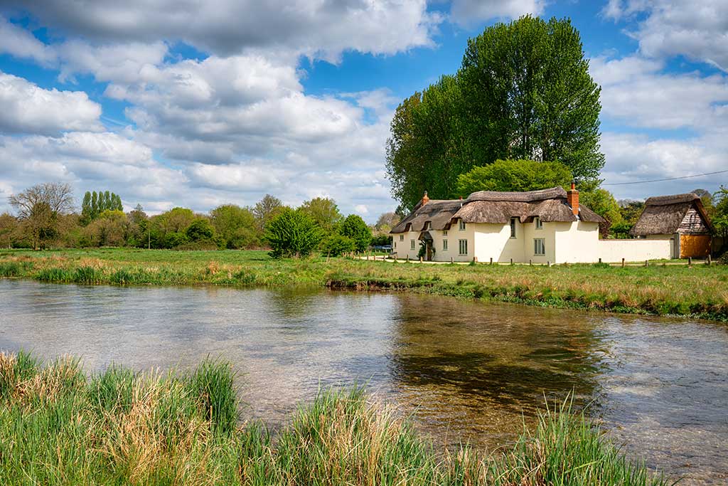 Photo showing thatched cottages